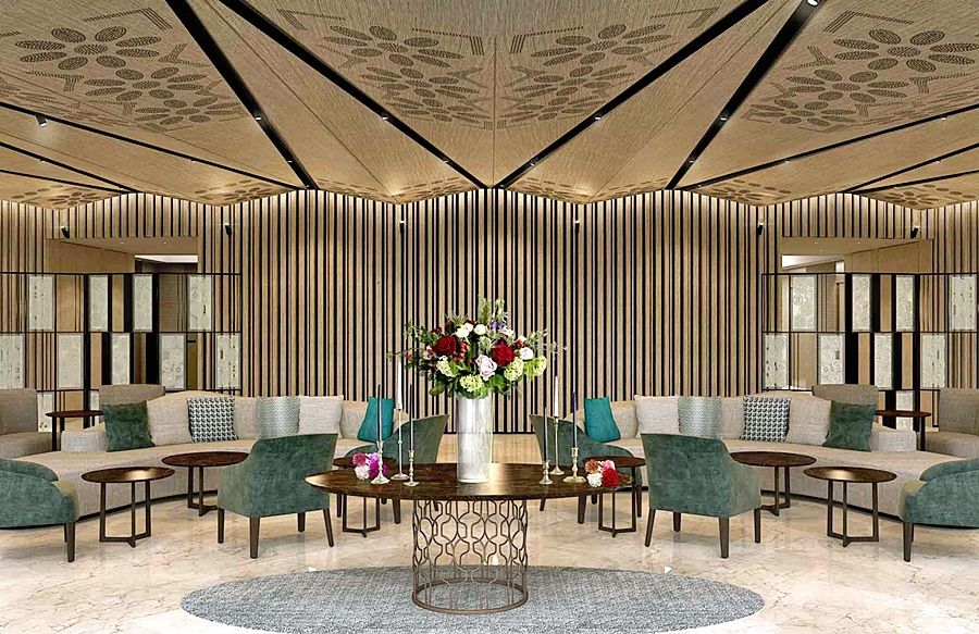 Eurostars Torre Sevilla Exterior foto The photo depicts a stylish and modern lounge area. The interior features a sophisticated design with a high ceiling adorned with a decorative pattern. It includes multiple seating arrangements consisting of comfortable chairs and sofas in shades of 